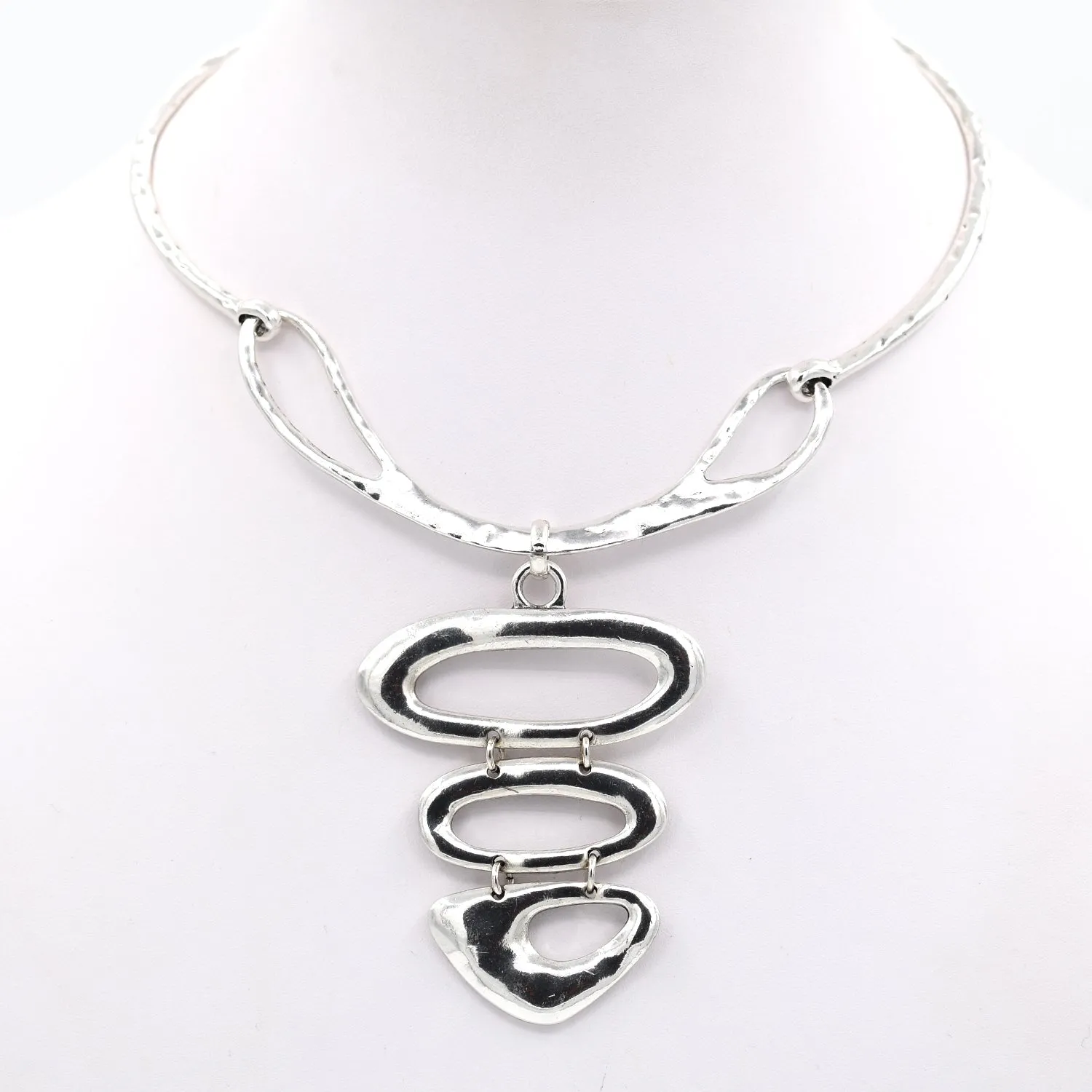 Graduated organic pendants on collar style necklace