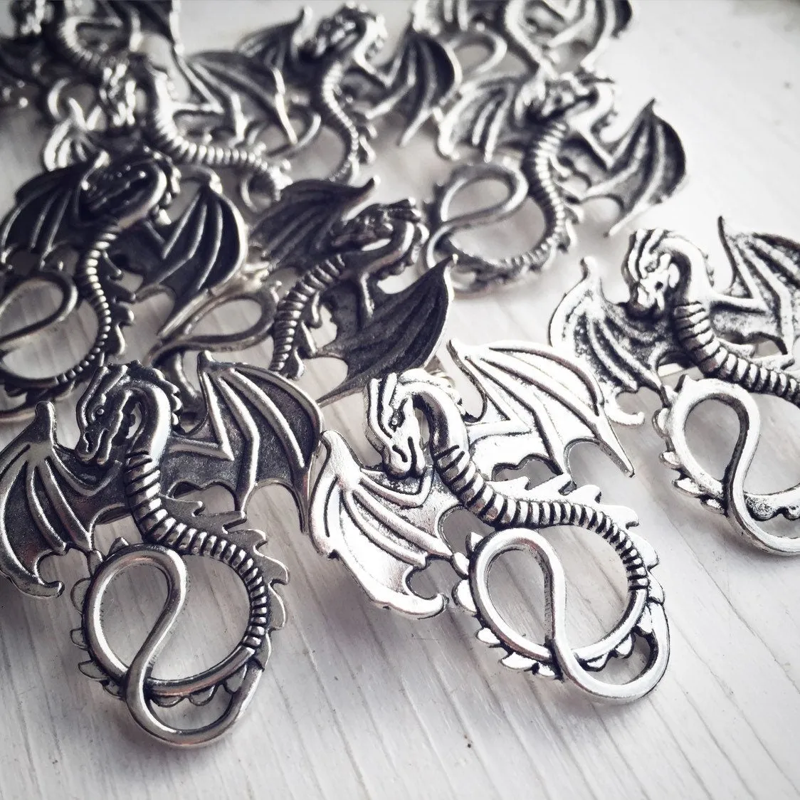 Pair of Dragon Brooches